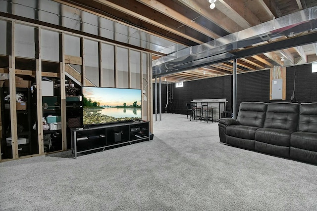 living room with carpet flooring and electric panel