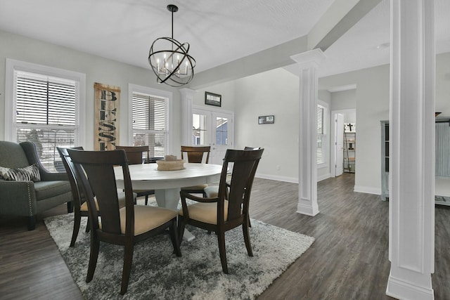 dining area featuring decorative columns, dark hardwood / wood-style floors, and french doors