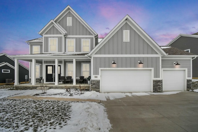 view of front facade with a garage and covered porch