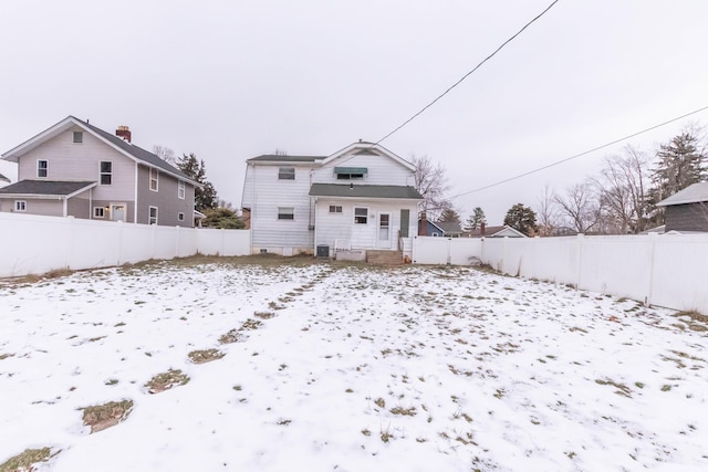 view of snow covered house