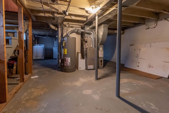 basement with heating unit, washer / dryer, and water heater