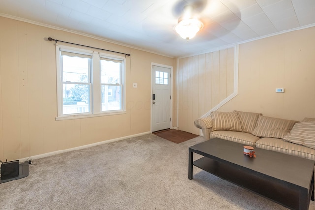 carpeted living room with crown molding