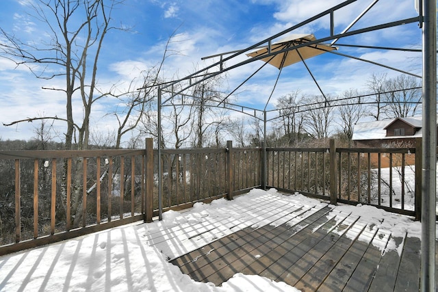 view of snow covered deck