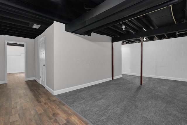 basement with dark carpet