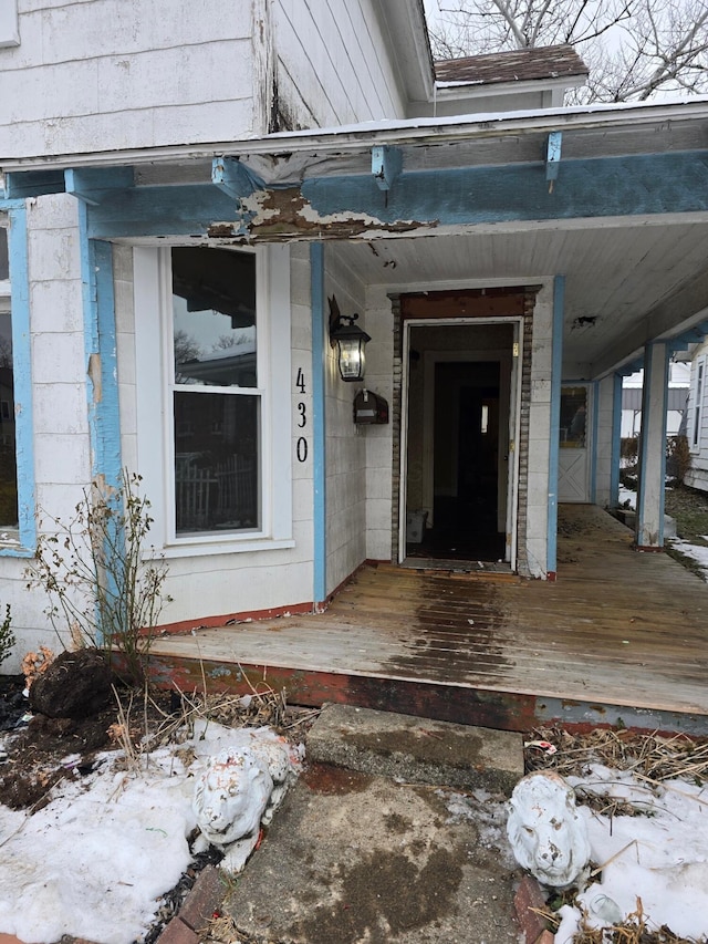 doorway to property featuring a porch