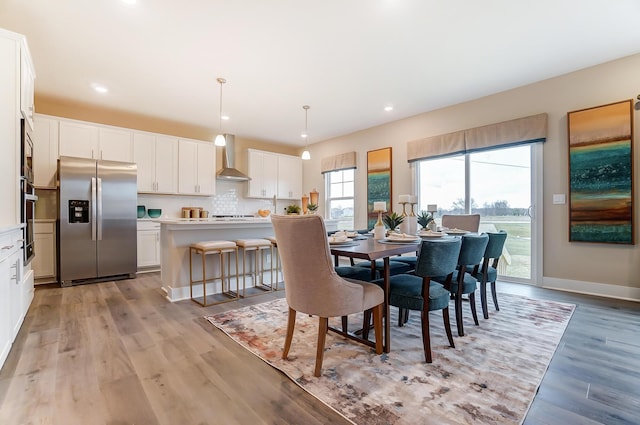 dining room featuring light hardwood / wood-style flooring