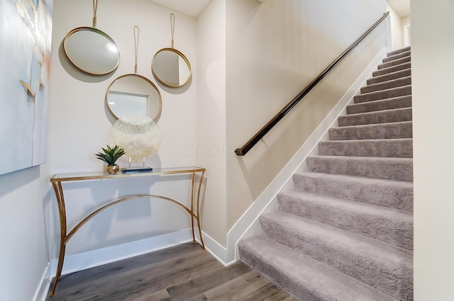 staircase featuring hardwood / wood-style floors