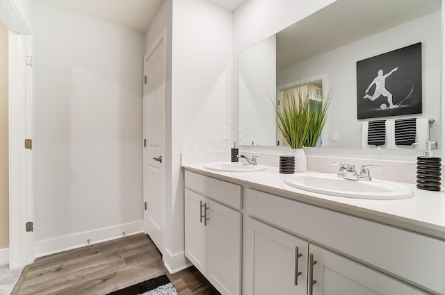 bathroom featuring vanity and hardwood / wood-style floors