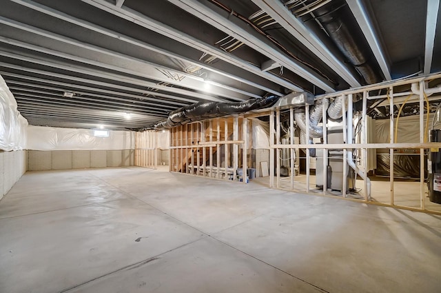 basement featuring electric water heater