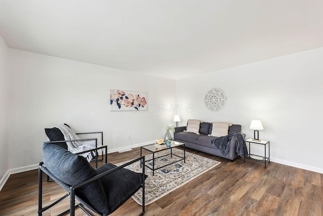 living room with dark hardwood / wood-style floors