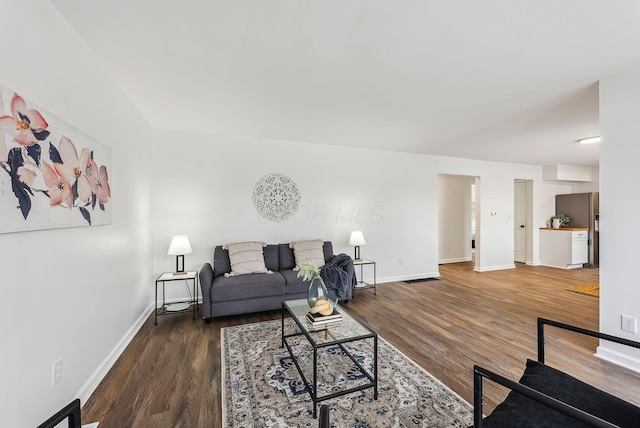 living room featuring dark hardwood / wood-style floors