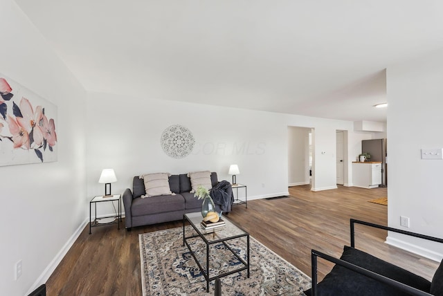 living room with dark hardwood / wood-style floors