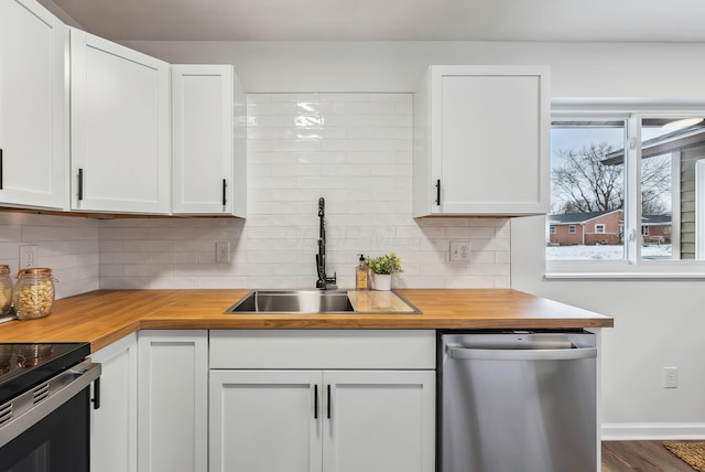 kitchen with sink, white cabinets, and dishwasher