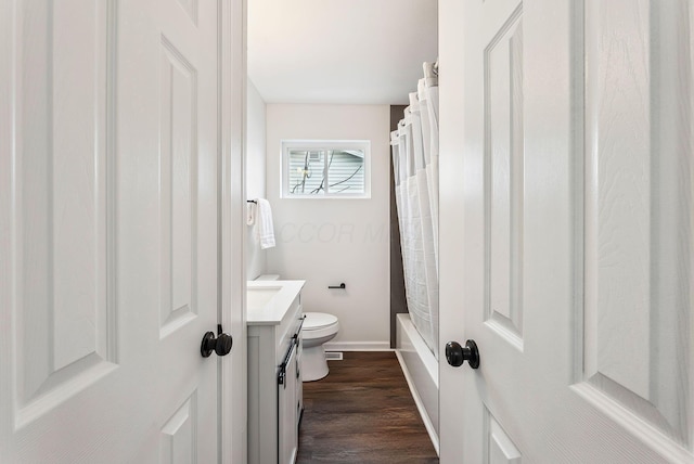 full bathroom featuring vanity, wood-type flooring, shower / bath combo, and toilet