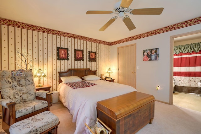 carpeted bedroom featuring connected bathroom and ceiling fan