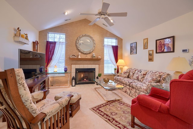 living room with high vaulted ceiling, a fireplace, light colored carpet, and ceiling fan