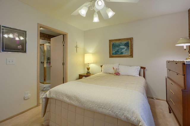 carpeted bedroom with ceiling fan and ensuite bathroom