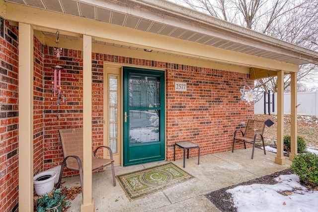 view of snow covered property entrance