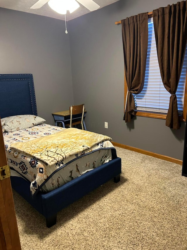 bedroom with ceiling fan and carpet