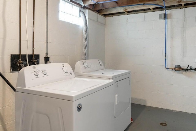 laundry area featuring washing machine and clothes dryer