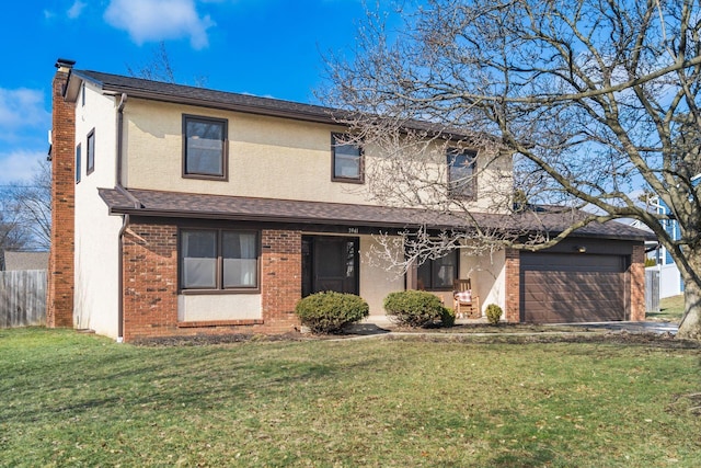 view of front property featuring a garage and a front yard