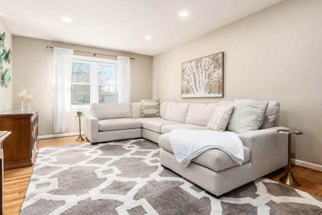 living room with light hardwood / wood-style flooring