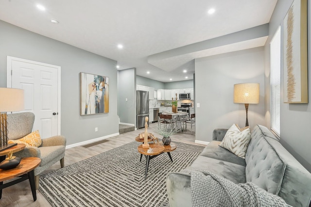 living room with light hardwood / wood-style floors