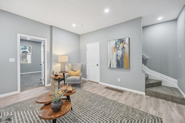 sitting room featuring light hardwood / wood-style floors