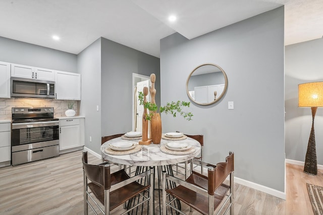 dining room featuring light hardwood / wood-style floors