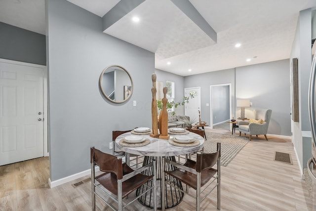 dining area with light hardwood / wood-style flooring