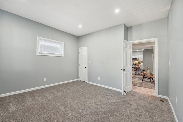 empty room with carpet flooring