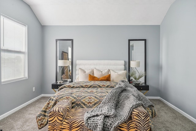 bedroom with lofted ceiling and carpet