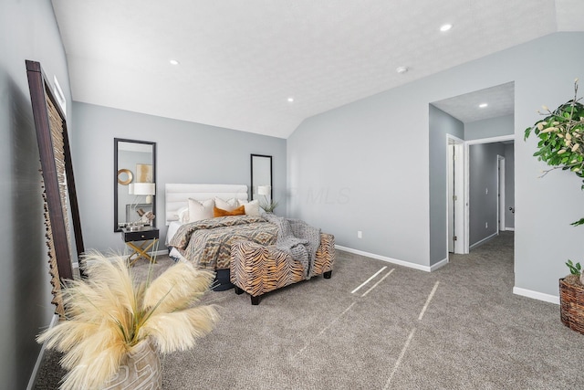 carpeted bedroom with vaulted ceiling