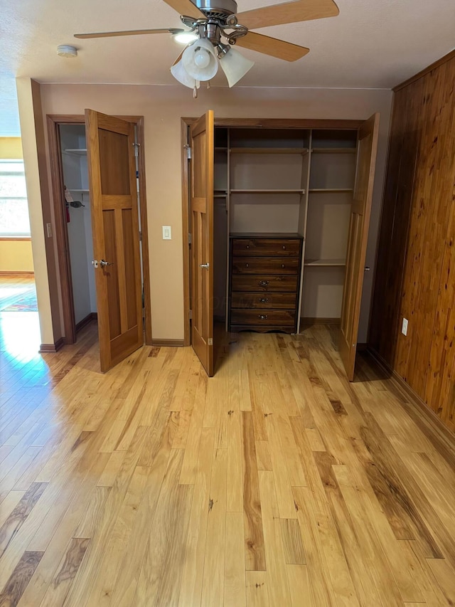 unfurnished bedroom featuring light hardwood / wood-style floors and ceiling fan