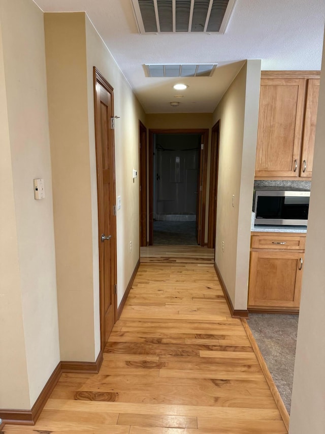 hall featuring light hardwood / wood-style floors