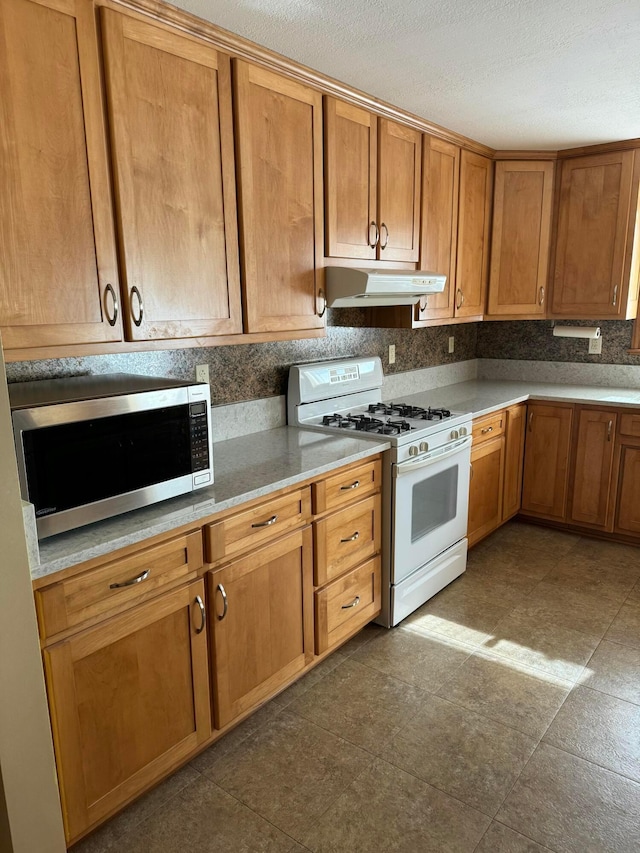 kitchen featuring white gas range