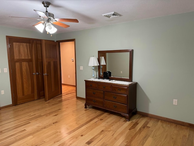 bedroom featuring ceiling fan and light hardwood / wood-style flooring