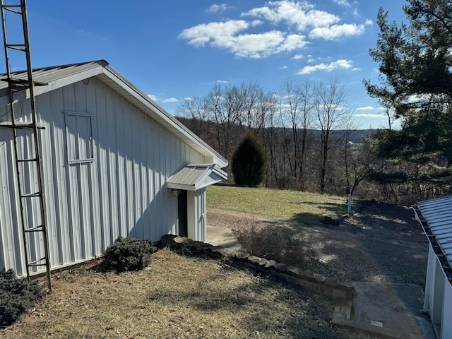 view of property exterior featuring a lawn