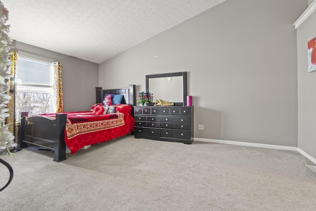 bedroom featuring lofted ceiling, a textured ceiling, and carpet flooring