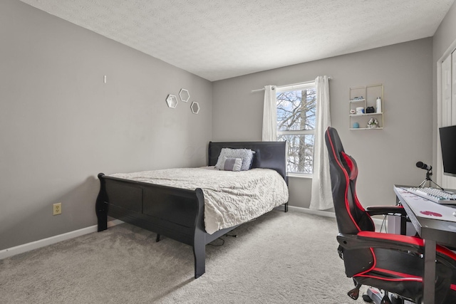 carpeted bedroom with a textured ceiling