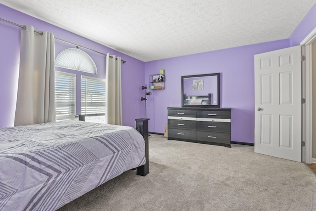 carpeted bedroom with a textured ceiling