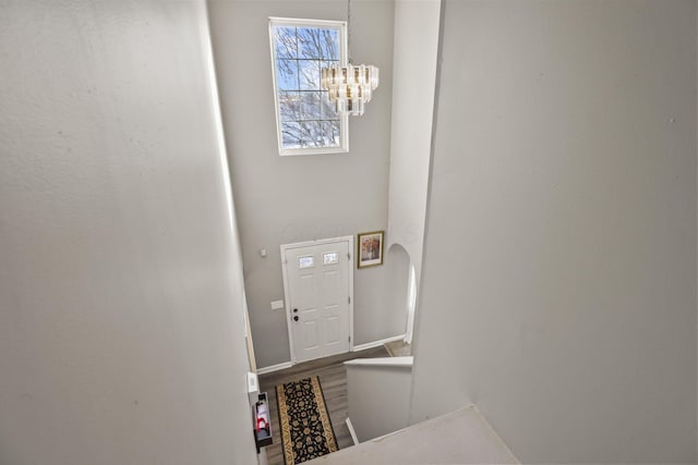 foyer with a chandelier