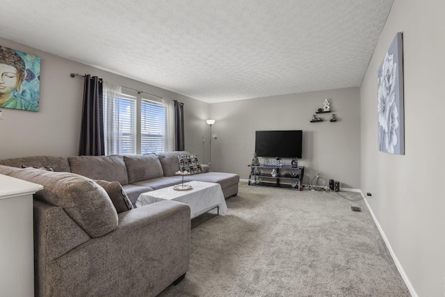 carpeted living room featuring a textured ceiling