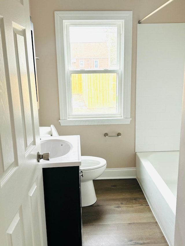 full bathroom with vanity, toilet, tub / shower combination, and wood-type flooring