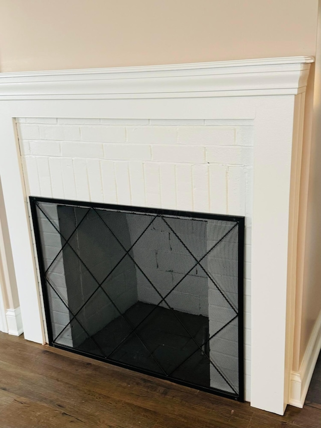 interior details featuring hardwood / wood-style flooring