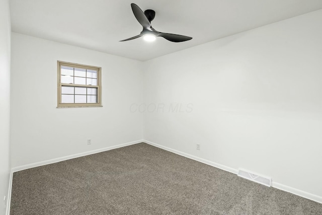 empty room featuring ceiling fan and carpet flooring