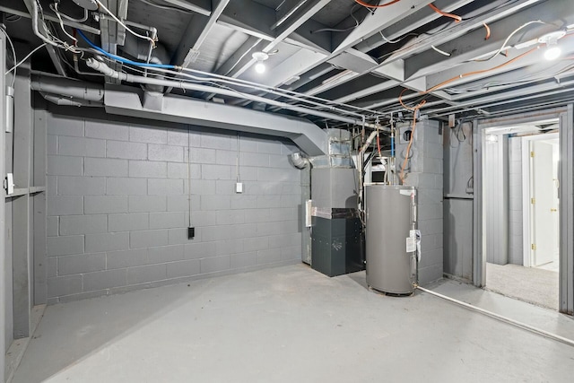 basement featuring heating unit and water heater