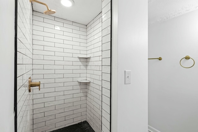 bathroom featuring tiled shower