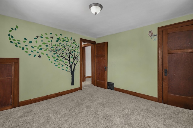 unfurnished bedroom with carpet floors