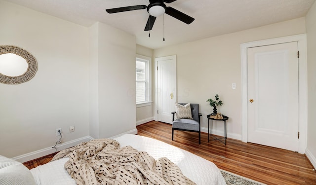 bedroom featuring ceiling fan and wood-type flooring